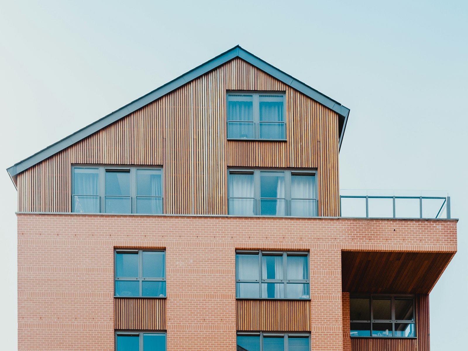 Triglav, a larch-clad gabled house with roof terrace